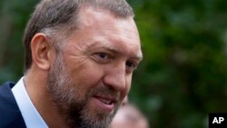 FILE - Russian metals magnate Oleg Deripaska attends Independence Day celebrations at Spaso House, the residence of the American ambassador, in Moscow, Russia, July 2, 2015.