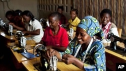 Women who have enrolled in international's programs in Rwanda and the Democratic Republic of the Congo are shown sewing.