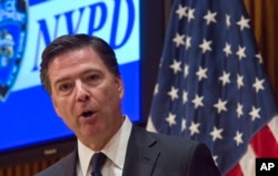 FILE - FBI Director James Comey speaks during a press conference at New York Police Department headquarters, Dec. 16, 2015. Comey has warned that data encryption is creating “millions of unbreakable safes.”