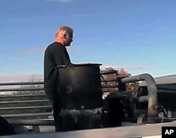 Rick Bates mounted a specialized wood burning stove in the bed of his 1969 GMC truck and connected it to the engine.