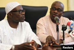 (L-R) Lateef Aderemi Ibirogba, Lagos' State Commissioner for Information and Strategy, sits with Dr. Jide Idris, the Commissioner for Health, during a news conference on the death of an Ebola victim in Lagos, July 25, 2014.