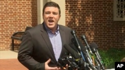 In this frame from video, Jason Kessler, a blogger based in Charlottesville, Va., speaks to the media, Aug. 13, 2017. Kessler, who organized the rally in Charlottesville on Saturday that sparked violent clashes between white supremacist groups and counter-protesters tried to hold a news conference, but a crowd booed him and forced him away from the lectern.