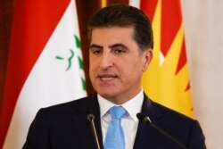 FILE - Nechirvan Barzani, president of Iraq's autonomous Kurdistan Region, speaks at a press conference in Arbil, the capital of northern Iraq's Kurdistan autonomous region, Aug. 29, 2021.