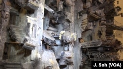 Artist Mohamed Hafez's miniature streetscapes are built with meticulous detail. Can you spot the clothesline here?