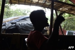 This photo taken on September 26, 2017 shows a Rohingya refugee who said he was a member of the Arakan Rohingya Salvation Army in a refugee camp in Bangladesh's Cox's Bazar district.