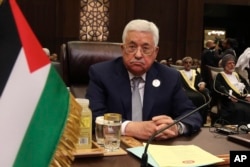 FILE - Palestinian President Mahmoud Abbas attends the summit of the Arab League at the Dead Sea, Jordan, March 29, 2017.