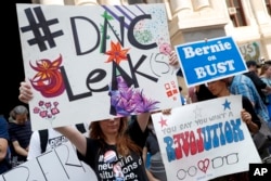 Demonstrators make their way around downtown, July 25, 2016, in Philadelphia, during the first day of the Democratic National Convention.