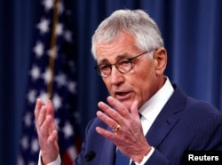 FILE - Then-U.S. Defense Secretary Chuck Hagel, shown talking to reporters in January 2015, said in a report that the Pentagon knows preventing sexual assault involves more than mere training or safety briefings.