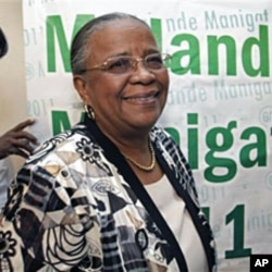 Haiti's presidential candidate and former first lady Mirlande Manigat smiles after a press conference in Port-au-Prince, Mar 14 2011