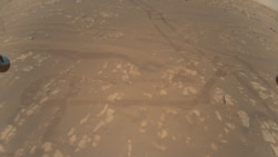 This is the first color image of the Martian surface taken by an aerial vehicle while it was aloft. The Ingenuity Mars Helicopter captured it with its color camera during its second successful flight test on April 22, 2021. (NASA/JPL-Caltech)