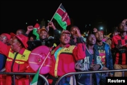 Supporters of incumbent President Uhuru Kenyatta celebrate after he was announced winner of the presidential election in Nairobi, Aug. 11, 2017.