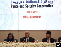 FILE - In this Wednesday, Feb. 28, 2018 file photo, Afghanistan's President Ashraf Ghani, center, speaks during the 2nd Kabul Process conference at the Presidential Palace in Kabul.