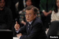 Moon Jae-in, the presidential candidate of the Democratic Party of Korea, speaks during a televised debate in Goyang, South Korea, April 25, 2017.