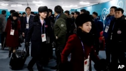 Members of the North Korean Olympic delegation arrive at the Olympic Village of the 2018 Winter Olympics in Gangneung, South Korea, Feb. 1, 2018.