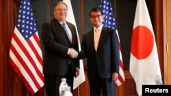 U.S. Secretary of State Mike Pompeo shakes hands with Japan's Foreign Minister Taro Kono during a bilateral meeting at a hotel in Seoul, South Korea, June 14, 2018.