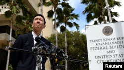 Hawaii Attorney General Douglas Chin answers questions from the media at the U.S. District Court Ninth Circuit after presenting his arguments after filing an amended lawsuit against President Donald Trump's new travel ban in Honolulu, Hawaii, March 15, 20