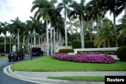 The motorcade of U.S. President Donald Trump arrives at Trump International Golf Club in West Palm Beach, Florida, April 15, 2017.
