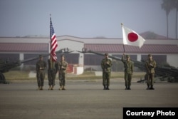Marines with 1st Battalion, 4th Marines, 1st Marine Division and Western Army Infantry Regiment, Japan Ground Self Defense Force stand in formation as part of the Exercise Iron Fist 2018 opening ceremony at Camp Pendleton, Calif., Jan. 12, 2018. (U.S. Marine Corps photo)