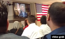 The new U.S. citizens received a personal greeting from U.S. President Barack Obama, on a plasma screen TV. “You can help write the next great chapter in our American story,” Obama said. “I’m proud to welcome you as a new citizen of this country.”