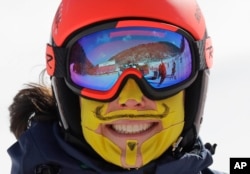 An Italian skier has her face covered in tape to protect her from the cold during an inspection of the giant slalom course at the Yongpyong Alpine Center at the 2018 Winter Olympics in Pyeongchang, South Korea, Feb. 11, 2018.