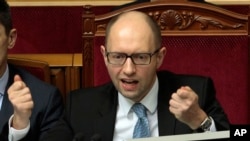 FILE - Ukrainian Prime Minister Arseniy Yatsenyuk is seen speaking to lawmakers in Kyiv, Ukraine.