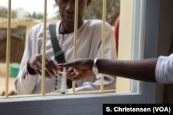 A former heroin addict receives his daily dose of methadone at Dakar's drug rehabilitation facility in Senegal, June 19, 2018.