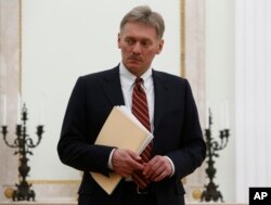FILE - Kremlin spokesman Dmitry Peskov is seen at the Kremlin in Moscow, March 27, 2017. Peskov likened a report detailing the wealth and political activities of Kremlin insiders and billionaires to a U.S. enemies list.