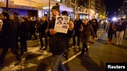 Demonstrators march against President-elect Donald Trump's election, in downtown Washington, after leaving Lafayette Park, near the White House, in Washington, Nov. 12, 2016.
