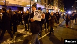 Demonstrators march against President-elect Donald Trump's election, in downtown Washington, U.S., after leaving Lafayette Park, near the White House, in Washington, Nov. 12, 2016.