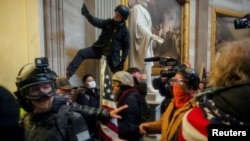 Trump supporters storm the US Capitol to contest the certification of the 2020 US presidential election results by the US Congress in Washington, Jan. 6, 2021.