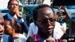 Tanzanian journalist Erick Kabendera speaks to journalists following his release from prison in Dar es Salaam, Feb. 24, 2020.