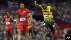Jamaica's Usain Bolt crosses the finish line ahead of United States' Ryan Bailey to win the men's 4x100-meter relay final during the athletics in the Olympic Park during the 2012 Summer Olympics, Saturday, Aug. 11, 2012, in London.