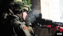 A U.S. paratrooper participates in a NATO exercise at an urban training center in Pabrade, Lithuania, Nov. 29, 2016.