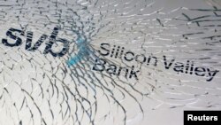 FILE - SVB (Silicon Valley Bank) logo is seen through broken glass in this illustration taken March 10, 2023.