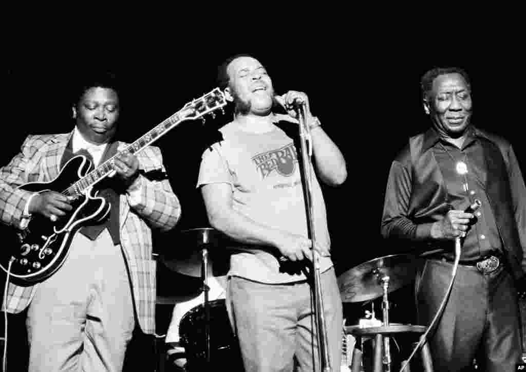 Blues musician B.B. King, left, James Cotton, center, and Muddy Waters perform together at radio city music hall in New York , June 29, 1979. 