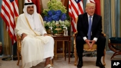 U.S. President Donald Trump, right, holds a bilateral meeting with Qatar's Emir Sheikh Tamim Bin Hamad Al-Thani, in Riyadh, Saudi Arabia, May 21, 2017.