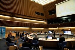 Tedros Adhanom Ghebreyesus, Director General of the WHO, and other officials attend the virtual 73rd World Health Assembly in Geneva, May 19, 2020.