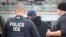 FILE - U.S. Immigration and Customs Enforcement (ICE) agents make an arrest in in Los Angeles, Feb. 7, 2017. 