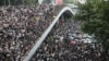 Protesters march along a road demonstrating against a proposed extradition bill in Hong Kong, China, June 12, 2019. 