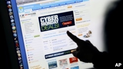 Consumer Carol Uyeno looks at Cyber Monday sales on her computer at her home in Palo Alto, Calif., Nov. 29, 2010.