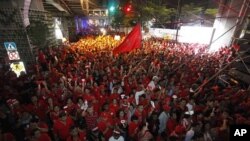 Thai anti-government 'red shirt' protesters gather at Bangkok's shopping district, decorated in red colors, 09 Jan 2011