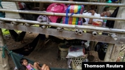 Villagers who fled Myanmar's Ee Thu Hta displacement camp rest in Mae Hong Son province, Thailand, near the border, while fleeing gunfire between ethnic minority Karen insurgents and Myanmar military, April 29, 2021.