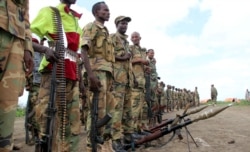 Jubbaland forces stand with their ammunitions as they prepare for a security patrol against Islamist al Shabaab militants in Bulagaduud town, north of Kismayo, Somalia, Aug. 17, 2015.