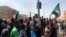 FILE - Protesters gather during what the Information Ministry calls a military coup in Khartoum, Sudan, Oct. 25, 2021. 
