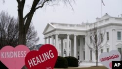 A Valentine's Day decoration, signed by first lady Jill Biden, sits on the North Lawn of the White House, Feb. 12, 2021, in Washington. 