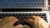 FILE - Hands type on a computer keyboard in Los Angeles. 