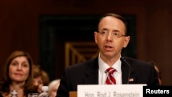 FILE - Rod Rosenstein testifies at his confirmation hearing before the Senate Judiciary Committee on Capitol Hill in Washington, March 7, 2017. 