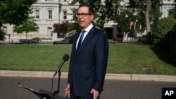 Treasury Secretary Steven Mnuchin speaks with reporters about the coronavirus relief package negotiations, at the White House, July 23, 2020, in Washington.