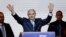 Israeli Prime Minister Benjamin Netanyahu waves to supporters at the party headquarters in Tel Aviv, March 18, 2015.