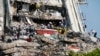 Workers search the rubble at the Champlain Towers South Condo, Monday, June 28, 2021, in Surfside, Fla. Many people were still unaccounted for after Thursday's fatal collapse. (AP Photo/Lynne Sladky)